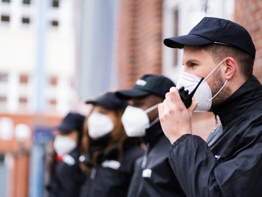 Security officers with face masks